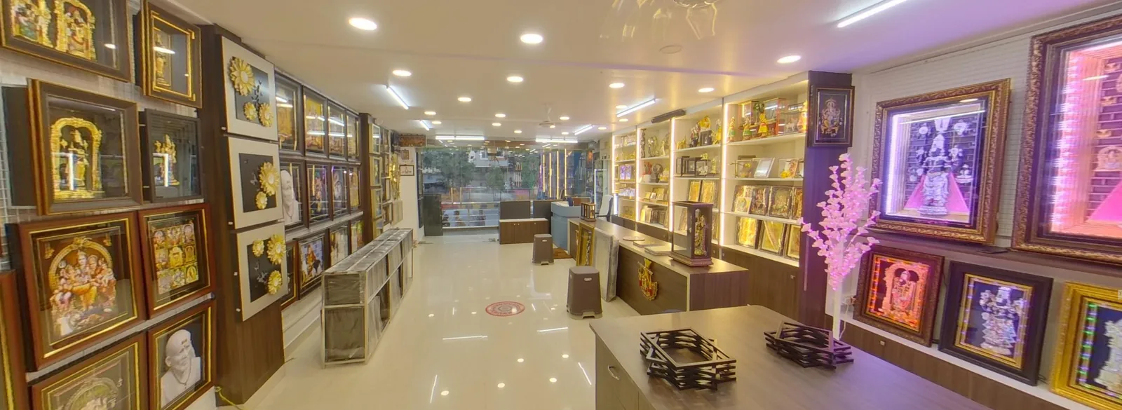 Inside the Vijayasai Photo Frames workshop in Tarapet, Vijayawada — craftsmen assembling custom wooden frames